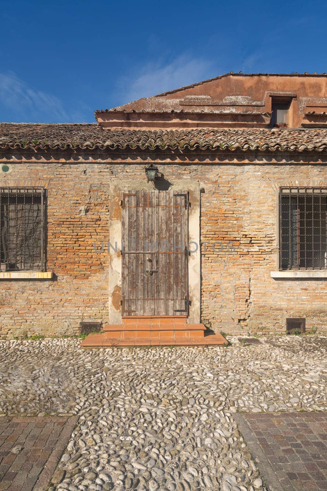the wooden entrance doors of old rural houses in the Italian countryside