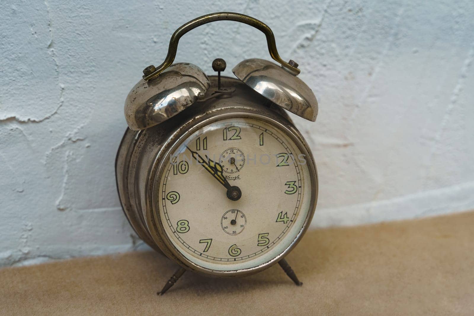 Poznan, Poland - June 18, 2023: Antique vintage alarm clock from Kienzle.