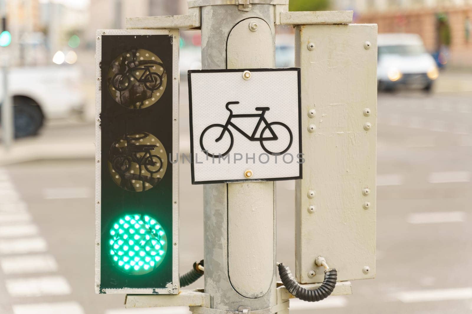 A traffic light showing a bicycle symbol, indicating a designated lane or area for cyclists to pass safely.