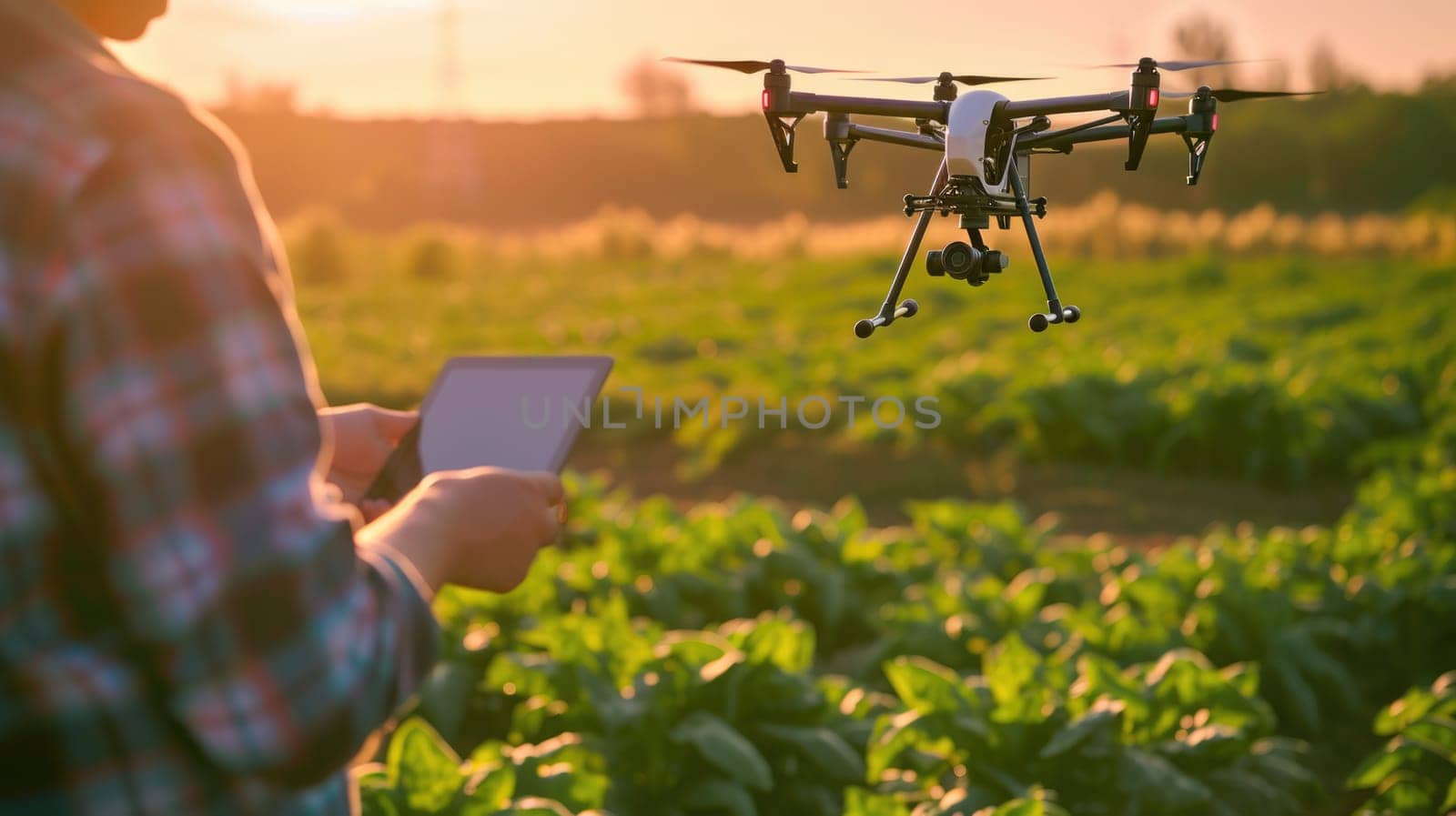 A woman is operating an aircraft in a grassy field, controlling it with a tablet amidst a beautiful natural landscape. AIG41