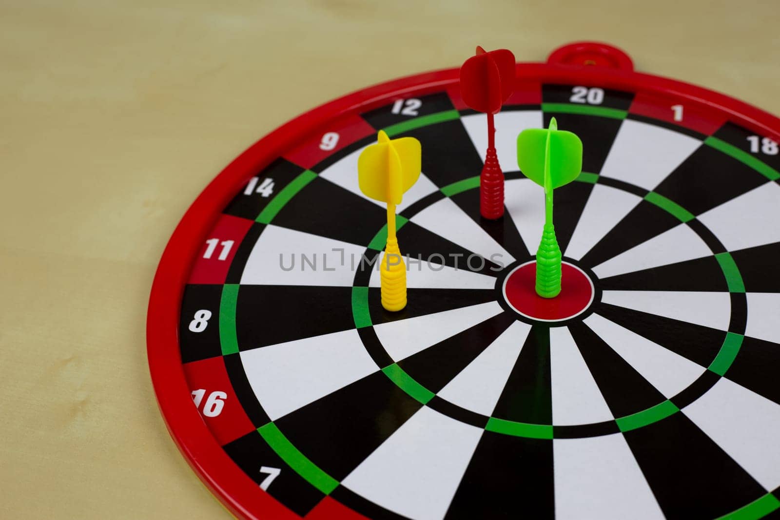 Magnetic dart in the center of target, scoring in throwing game for children, aiming to bullseye