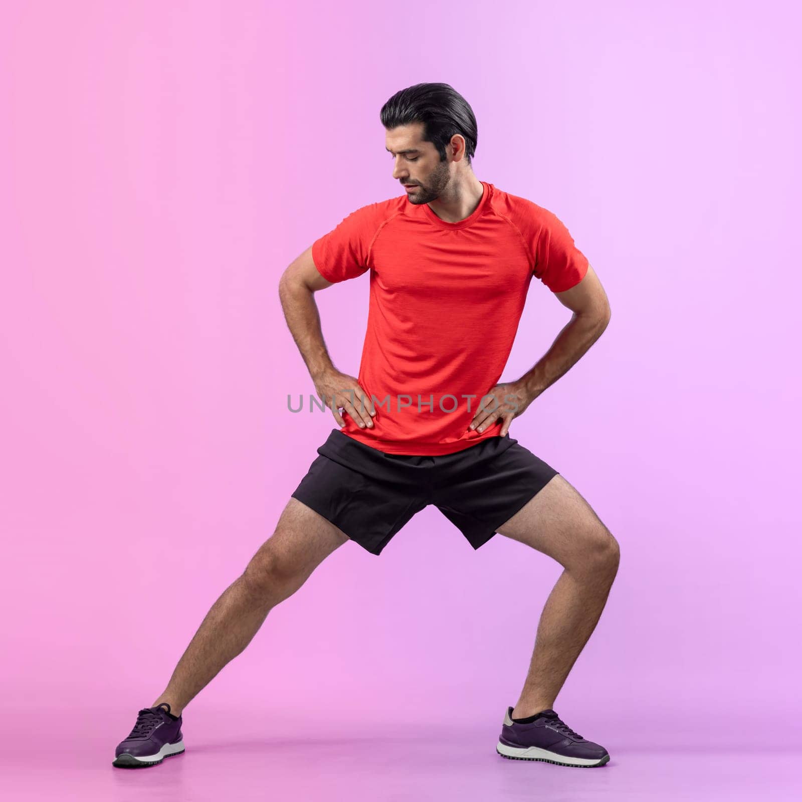 Full body length gaiety shot athletic sporty man with warmup posture by biancoblue