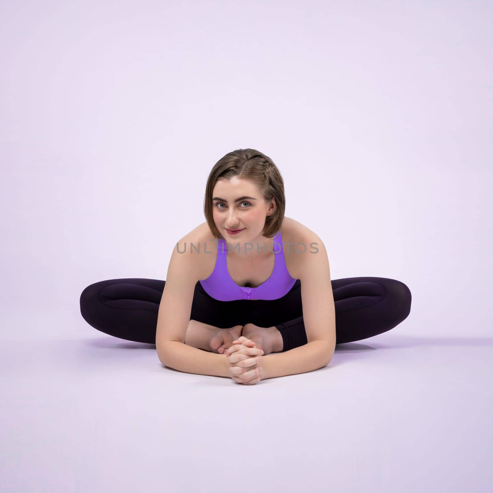 Full body length gaiety shot athletic and sporty woman doing yoga by biancoblue