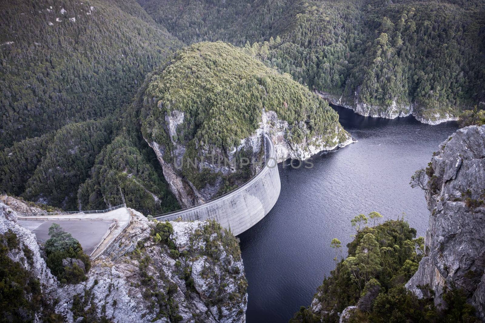 View of the Gordon Dam on a cool summer's day. It is a unique double curvature concrete arch dam with a spillway across the Gordon River near Strathgordon, South West Tasmania, Australia