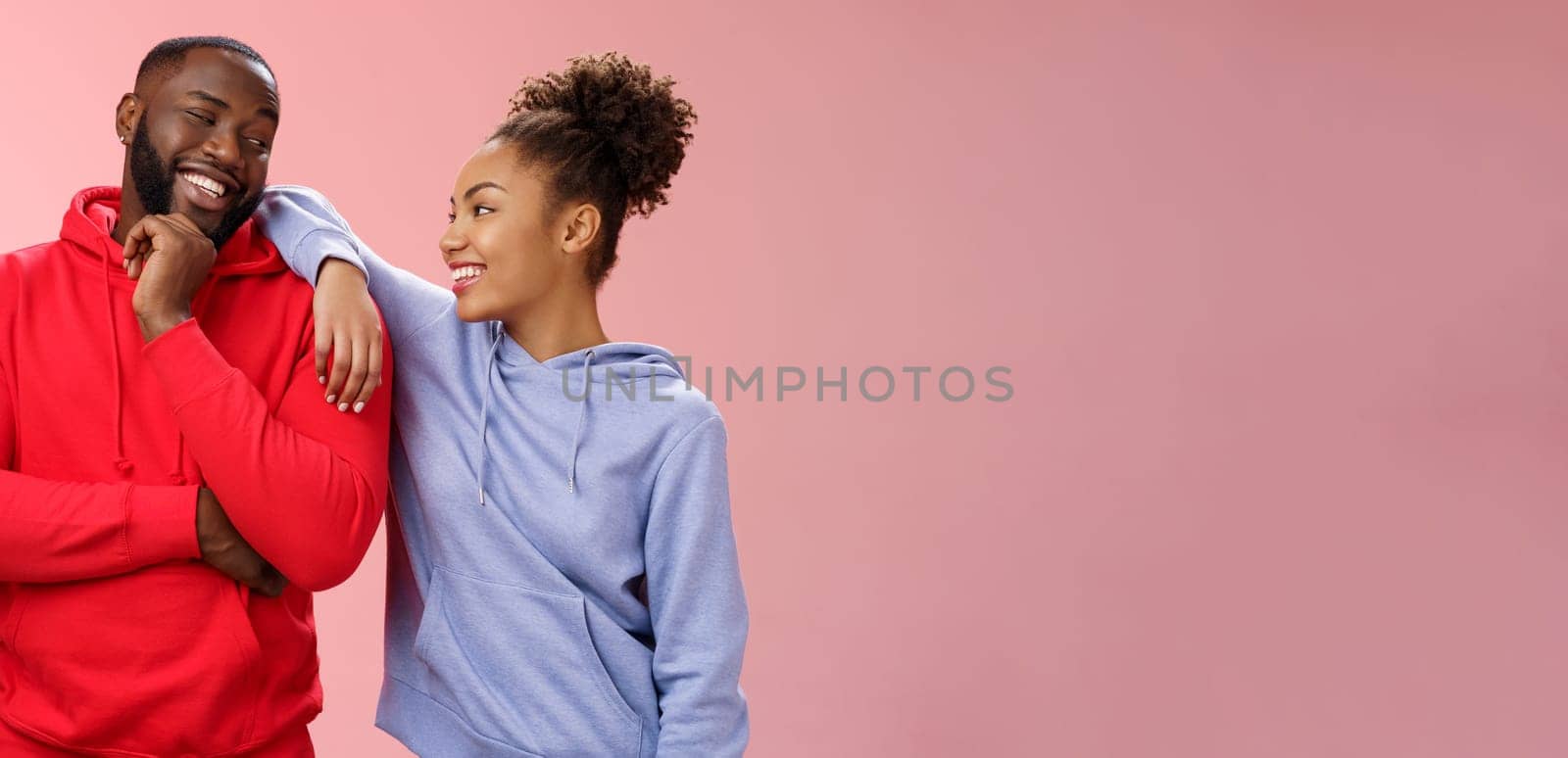 Two best friends having fun man smiling woman leaning his shoulder talking laughing joking like spending time together, standing pink background chit-chat confident relaxed poses by Benzoix