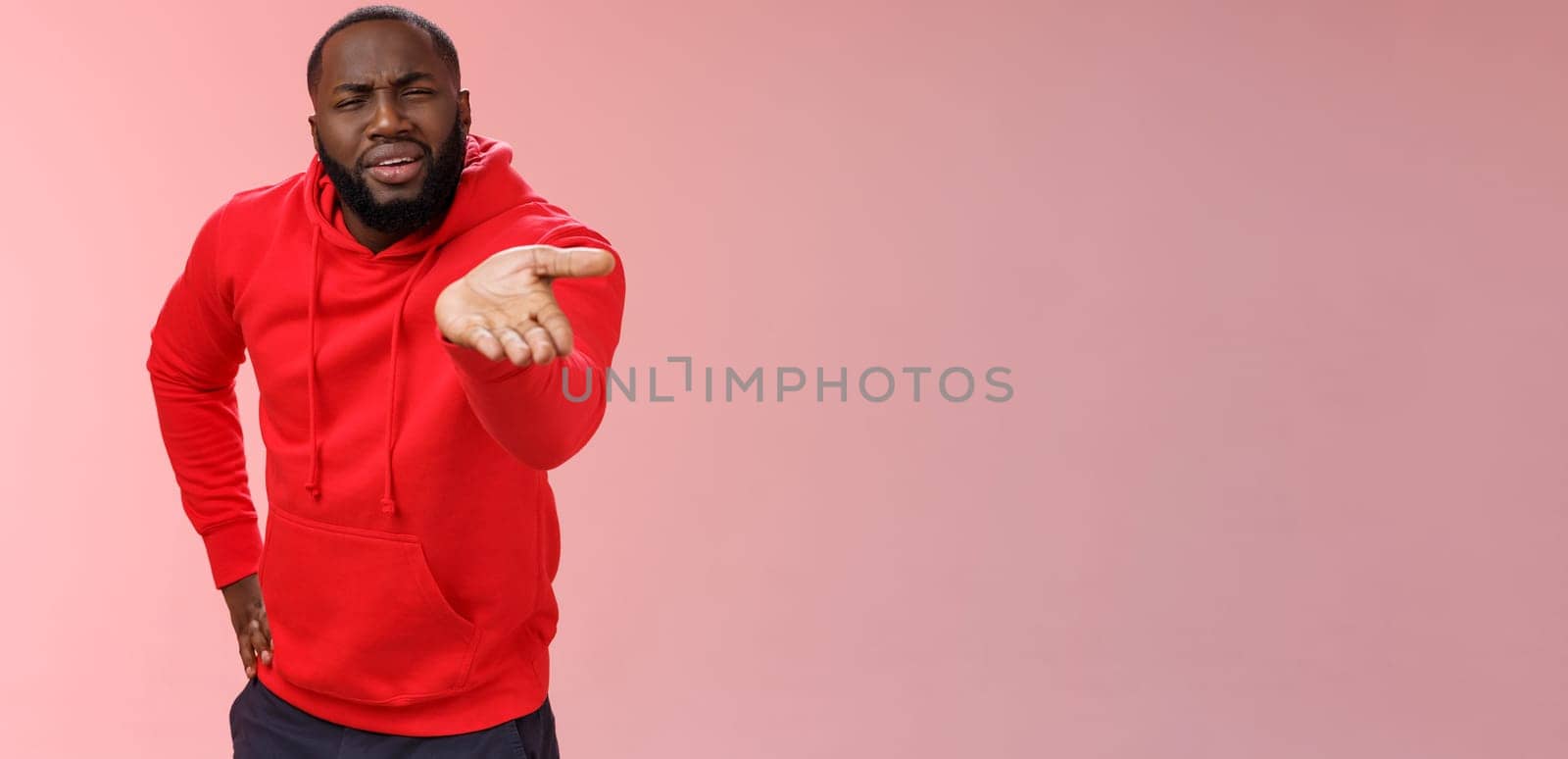 Displeased african-american man scolding friend acting bad asking what doing life pointing camera palm arguing standing disappointed judging mate outfit, standing pink background by Benzoix