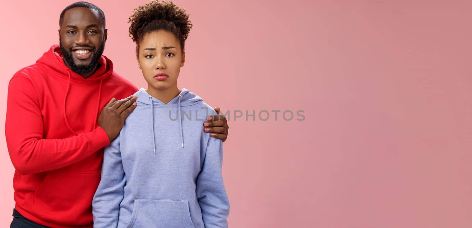 Girl unwilling participate event feel nervous insecure boyfriend encouraging hugging boost confidense assuring everything alright smiling self-assured promise everything be okay, pink background.