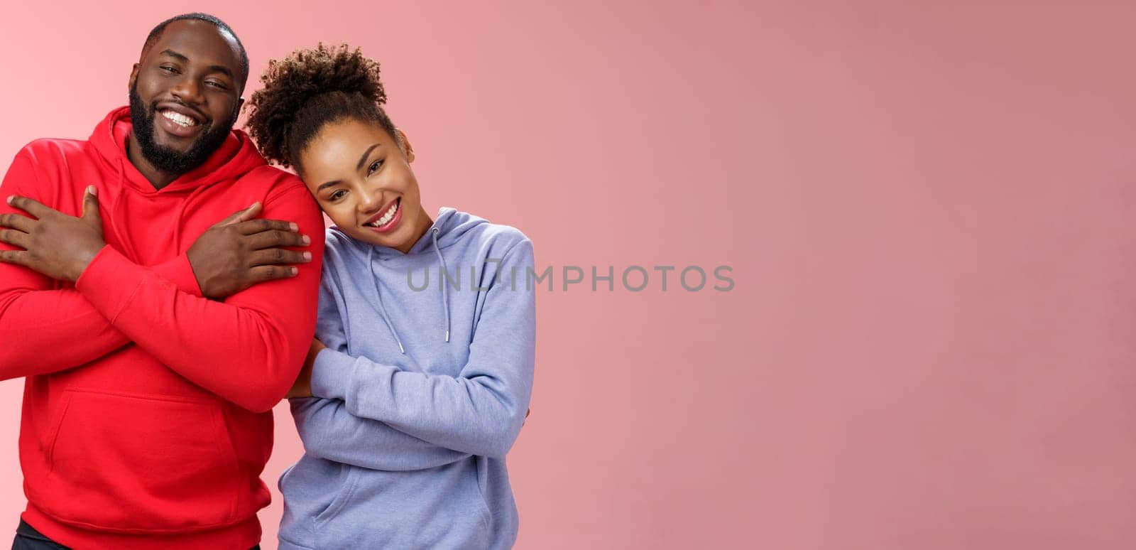 Lifestyle. Charming happy sincere african-american family guy girl relationship embracing cross arms chest hugging each other girlfriend lean boyfriend shoulder lovely couply smiling feel love warmth.