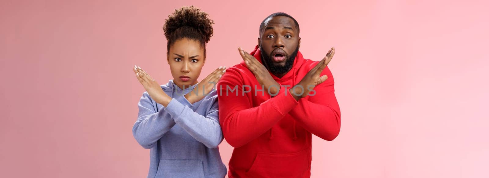 Serious-looking nervous panicking two african american guy girl showing cross stop gesture man feel worried shocked asking not do prohitibit action woman angry look camera demand quit by Benzoix