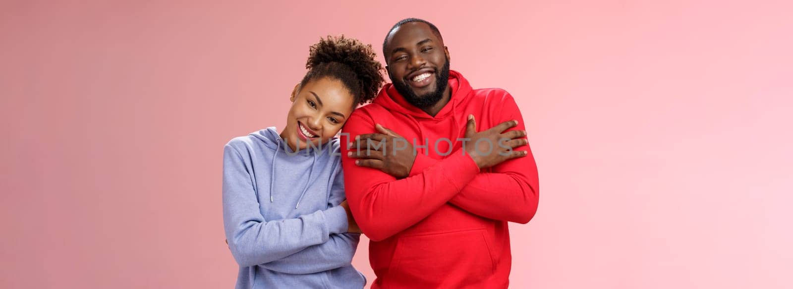 Lifestyle. Charming happy sincere african-american family guy girl relationship embracing cross arms chest hugging each other girlfriend lean boyfriend shoulder lovely couply smiling feel love warmth.