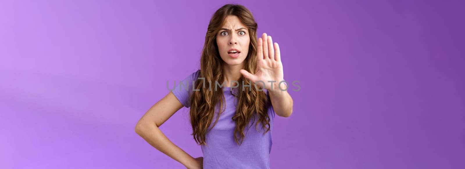 Serious-looking displeased assertive female friend stand confident demand stop smoking pull palm camera forbid disapproval gesture restrain you making bad choice purple background by Benzoix