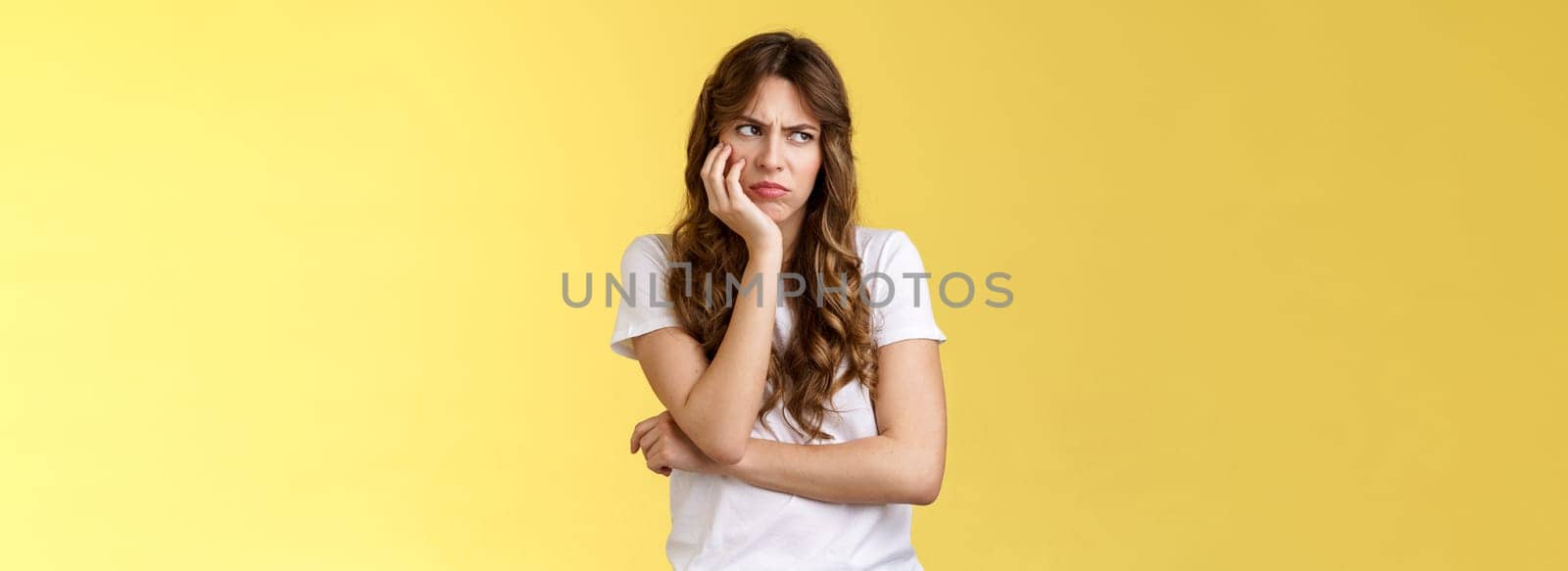 Jealous upset angry moody girlfriend lean palm smirking frowning bothered gloomy look aside turn left dismay sitting lonely offended overthinking drama queen stand yellow background by Benzoix