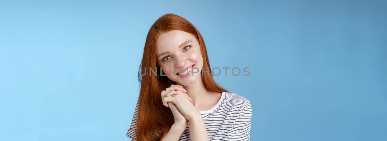 Romantic tender lovely redhead girlfriend tilting head press palms together smiling touched look sympathy check out cute picture friend standing delighted amused, heartwarming moment by Benzoix