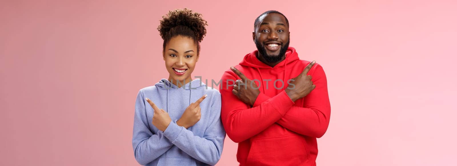 Lifestyle. Charming happy couple african american boyfriend girlfriend move in together pointing different sides cross arms chest left right smiling broadly upbeat have variety good choices opportunities.