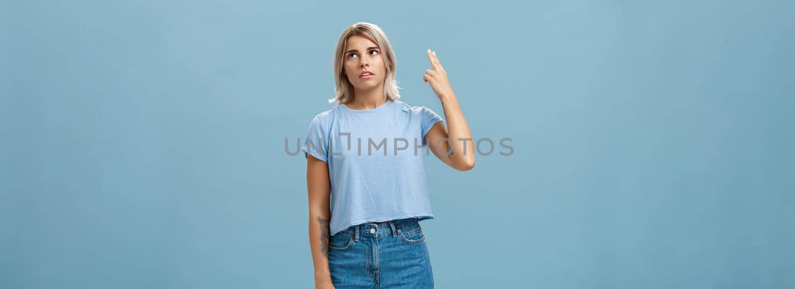 Stop teaching me how live my life. Portrait of irritated displeased attractive blonde female in denim shorts and casual t-shirt rolling eyelids from annoyance showing gun gesture as if blowing brains by Benzoix