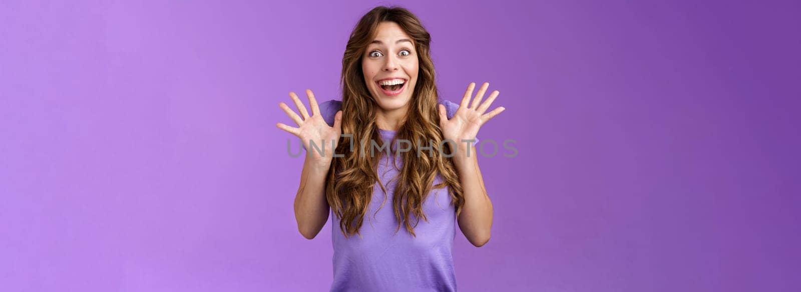 Impressed excited enthusiastic attractive lively girl celebrating good news gesturing shaking hands thrill joy smiling broadly found out great perfect event grinning joyfully purple background.