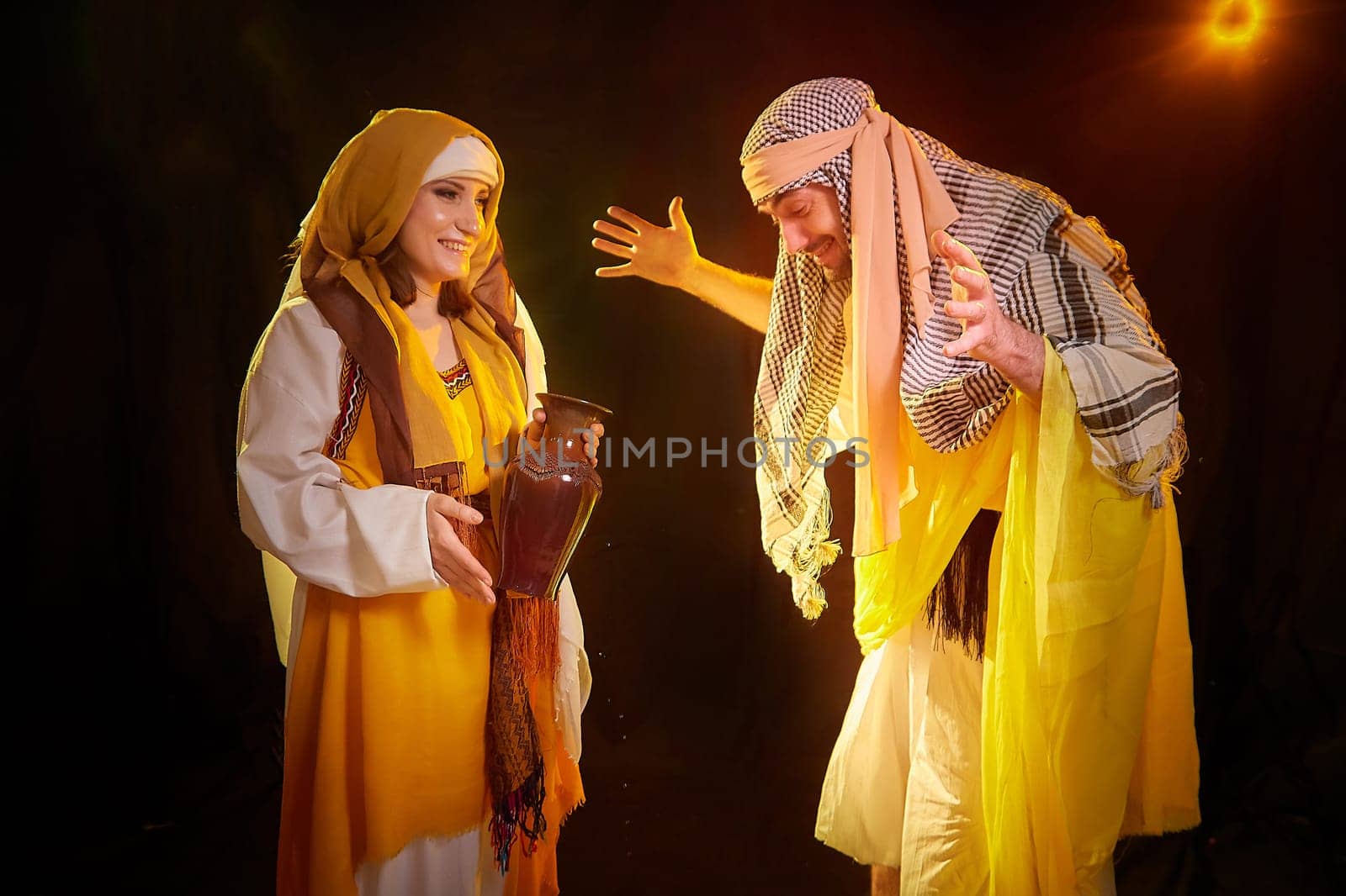 A couple in love or a married couple in stylized Eastern clothing from Israel, Palestine, Iran, Pakistan together. A tender photo session in the style of the Middle East and the Bible by keleny