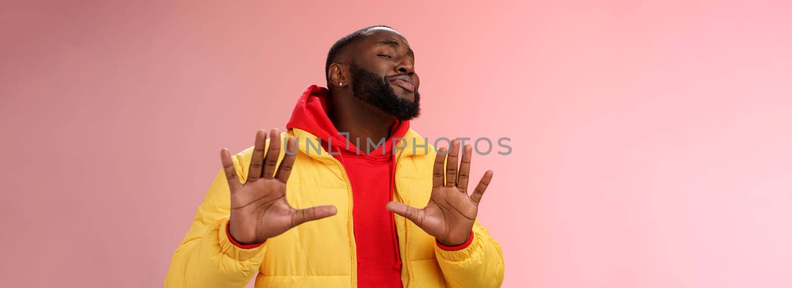 Relax I deal it. Unbothered chill good-looking confident bossy african bearded guy smiling asking enough stop apologizing raise palms calm down gesture grinning blushing heartwarming greeting.