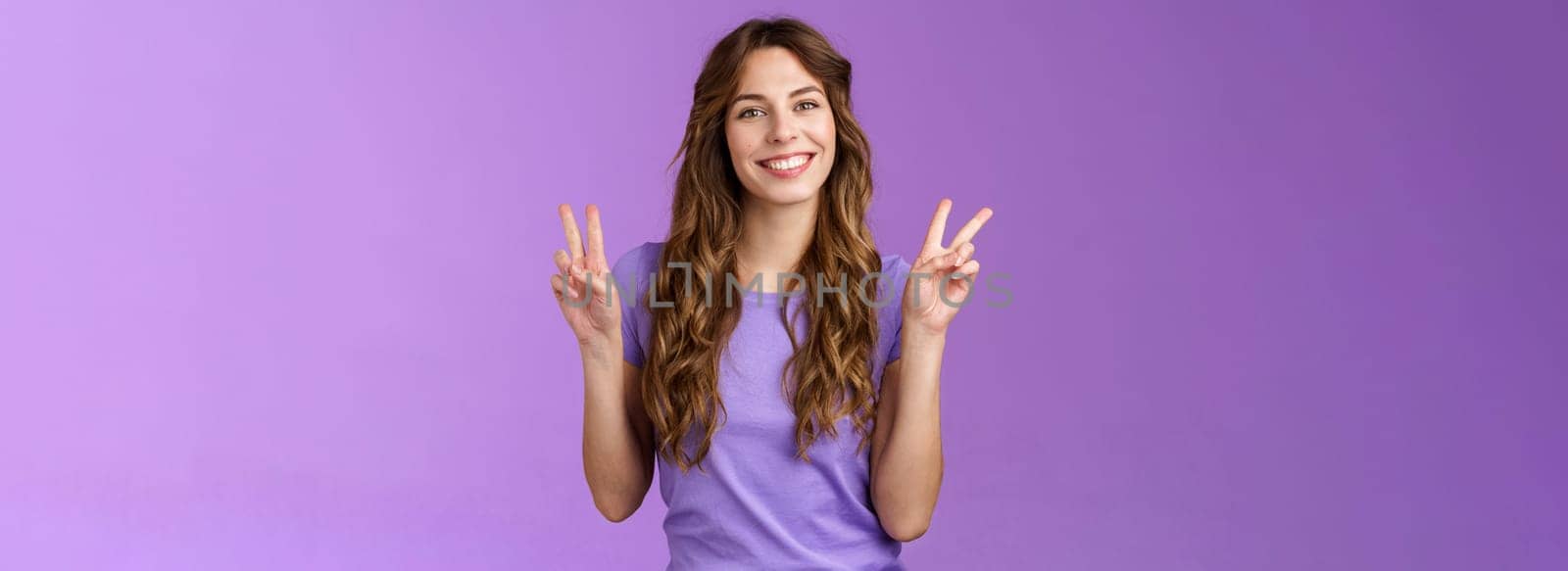 Peace friends. Relaxed friendly cute self-assured girl long curly hairstyle show victory sign smiling broadly cheering express positive optimistic attitude have fun enjoy summer purple background by Benzoix