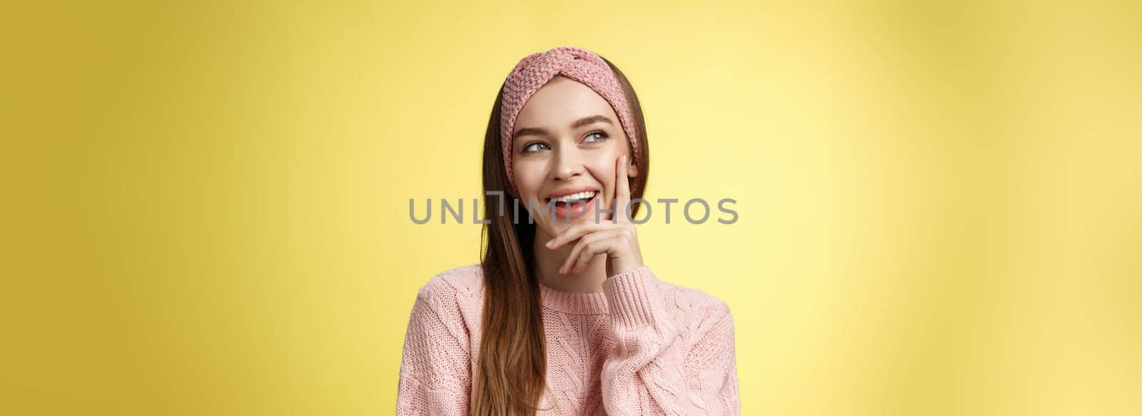 Girl having great idea, smirking delighted, proud herself, touching cheek smiling amused creating plan in mind looking at upper left corner pleased, intrigued and excited seeing awesome opportunity.