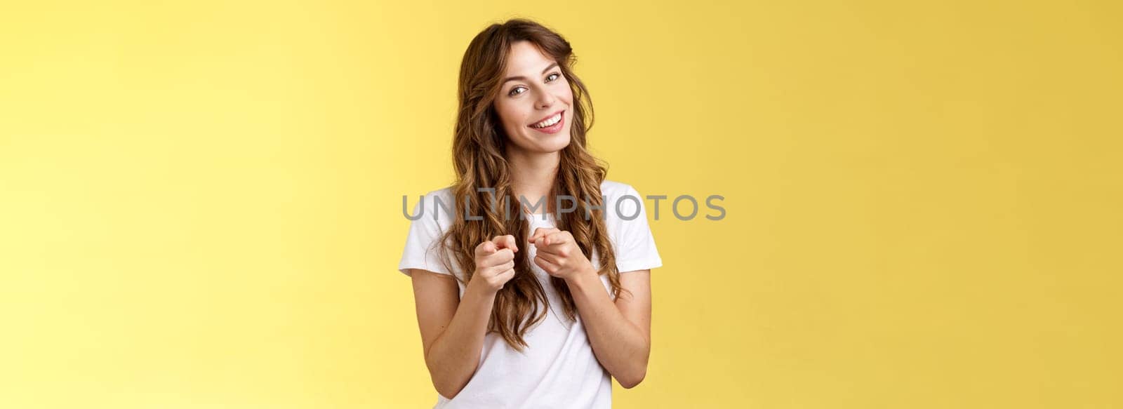 You can do it. Cheerful supportive enthusiastic curly-haired girl makeup artistis encourage girlfriend pointing camera indicating index finger congratulating friend good job yellow background by Benzoix