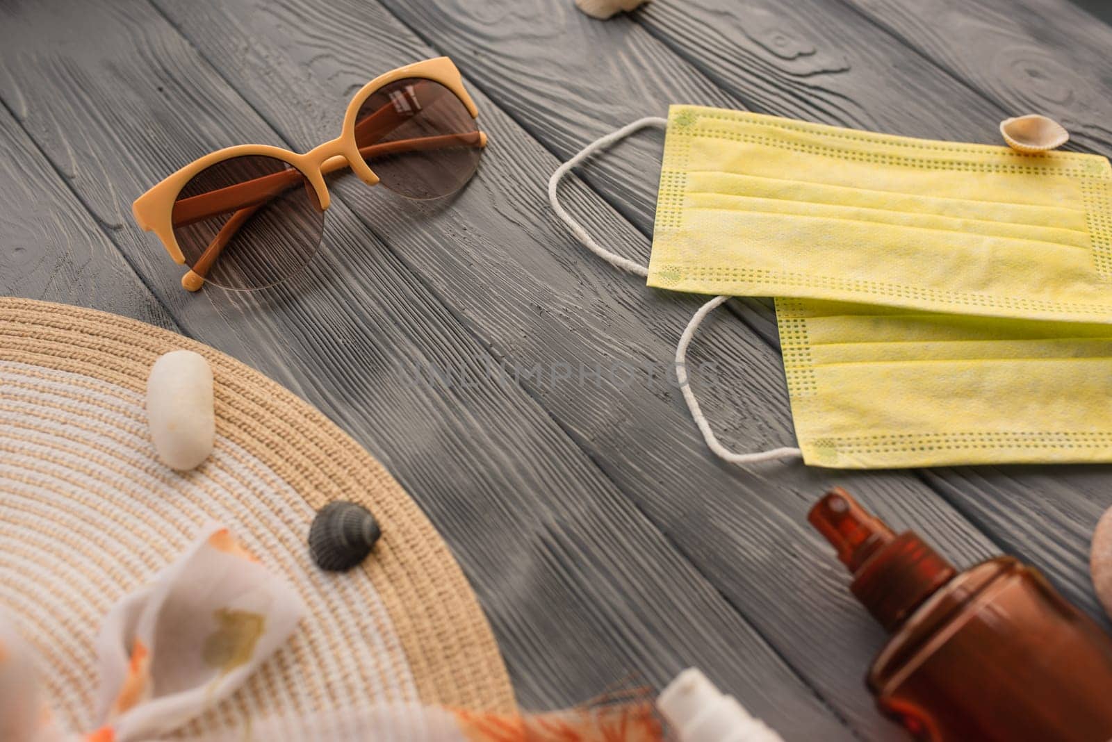New normal covid face mask hat bag sun protection sunglasses sunscreen spray lotion tan ultra-violet rays. Summer background template mockup free space pattern composition sample text. Top view above