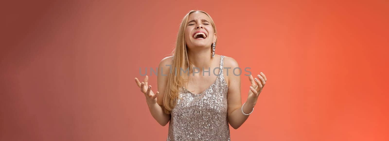 Relieved happy charming blond woman thank god shouting yes celebrating rejoicing win standing red background close eyes laughing happiness clench fists victory triumph gesture, dream came true by Benzoix