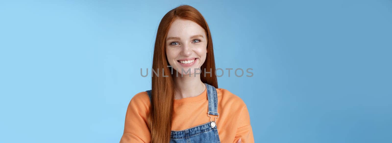 Lifestyle. Young stylish confident smiling female redhead freelancer assured job done great grinning satisfied hold hands crossed chest self-assured standing blue background good mood upbeat attitude.