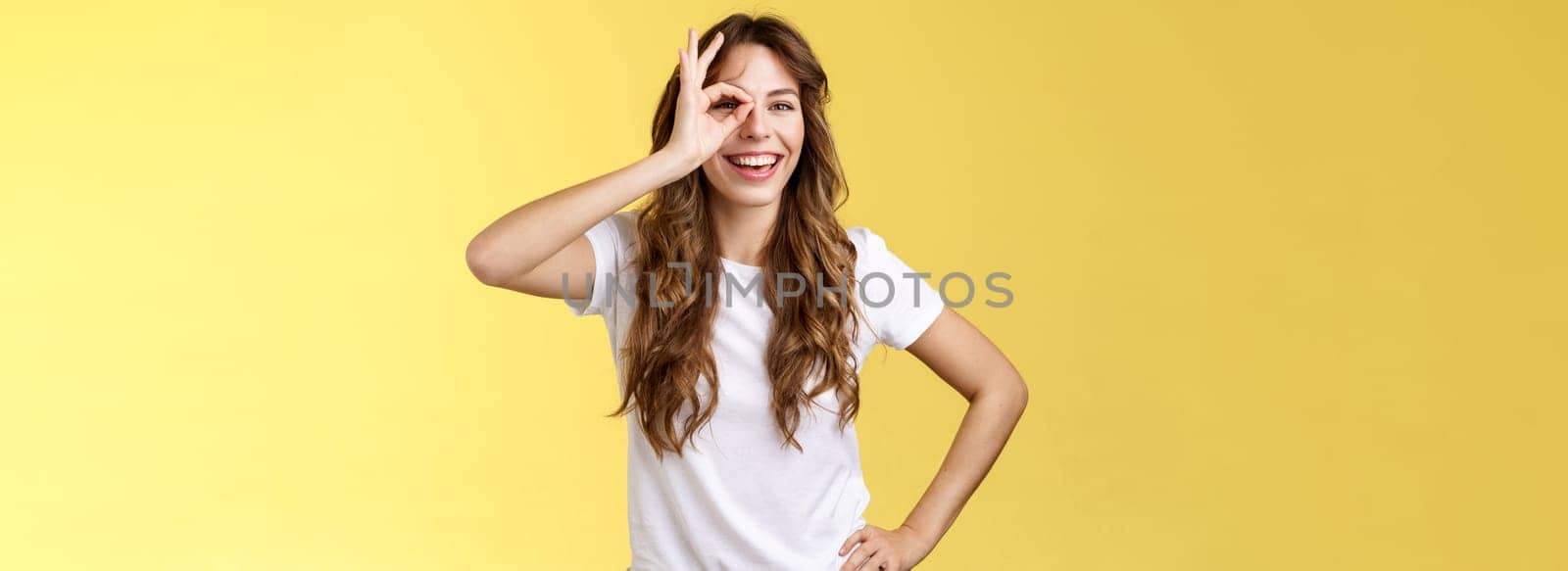 Everything be perfect believe yourself. Charismatic confident sassy young female coworker encourage friend try hard congratulate excellent job smiling broadly look through ring gesture.