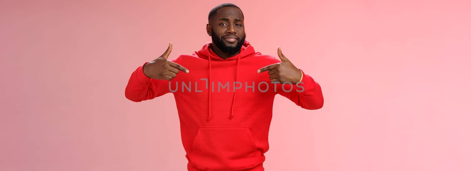 Proud cheeky confident young bearded african american man pointing himself bragging charish praise himself standing spotlight liking be center attention, smirking gladly, pink background.