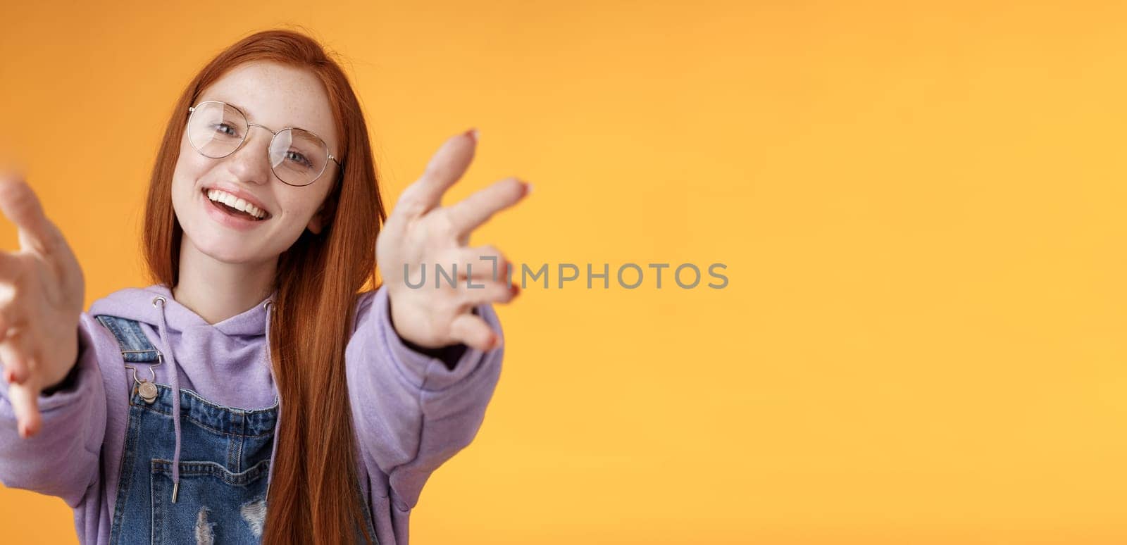 Come here let hold. Attractive silly friendly happy smiling redhead woman stretch arms camera grab product wanna tight friendship hugs grinning embracing cuddling besties, orange background by Benzoix