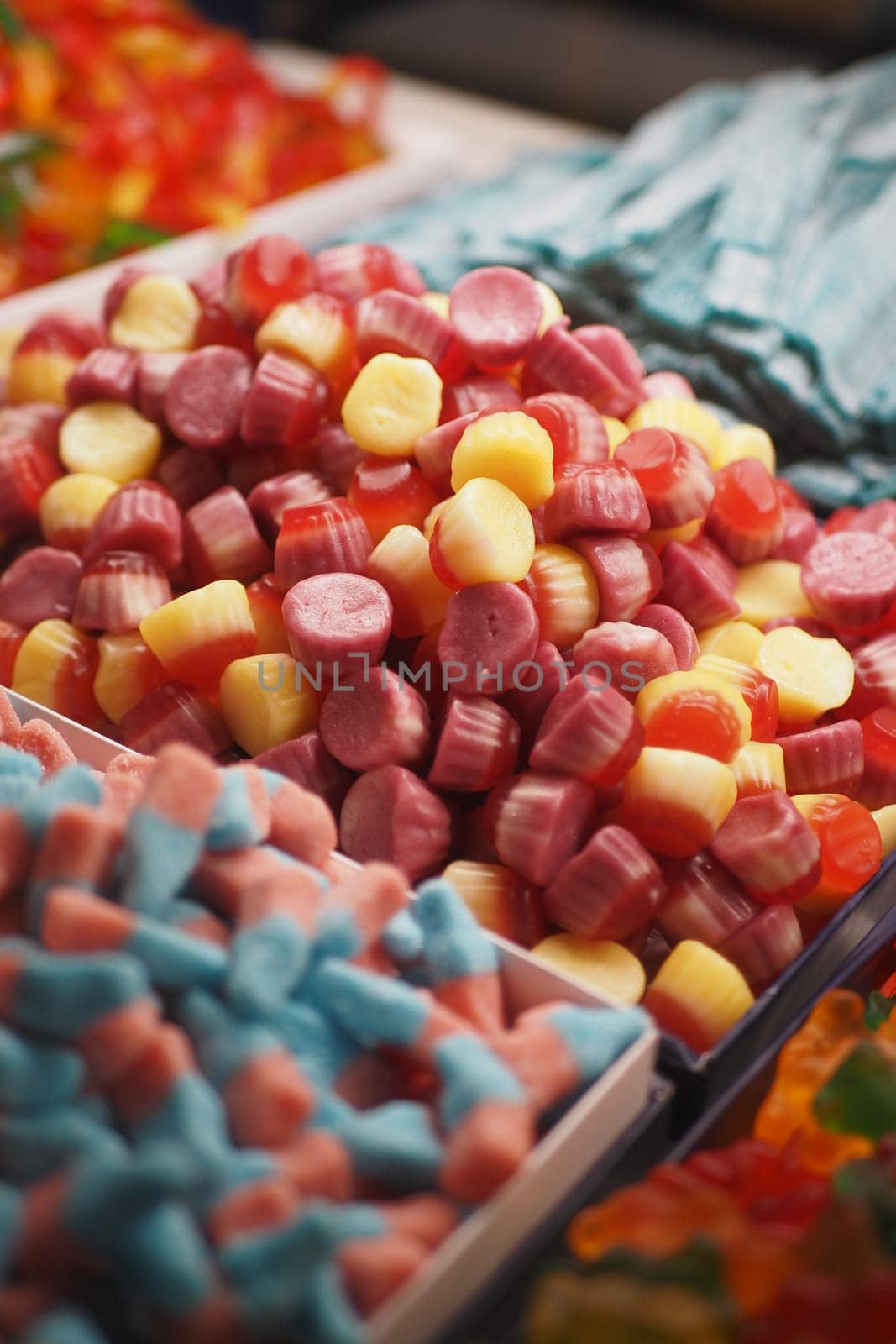 Mixed colorful jelly, gummy candies display for sales .