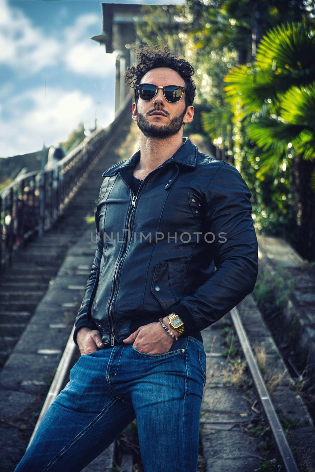 Man in black jacket and sunglasses posing for a picture by artofphoto