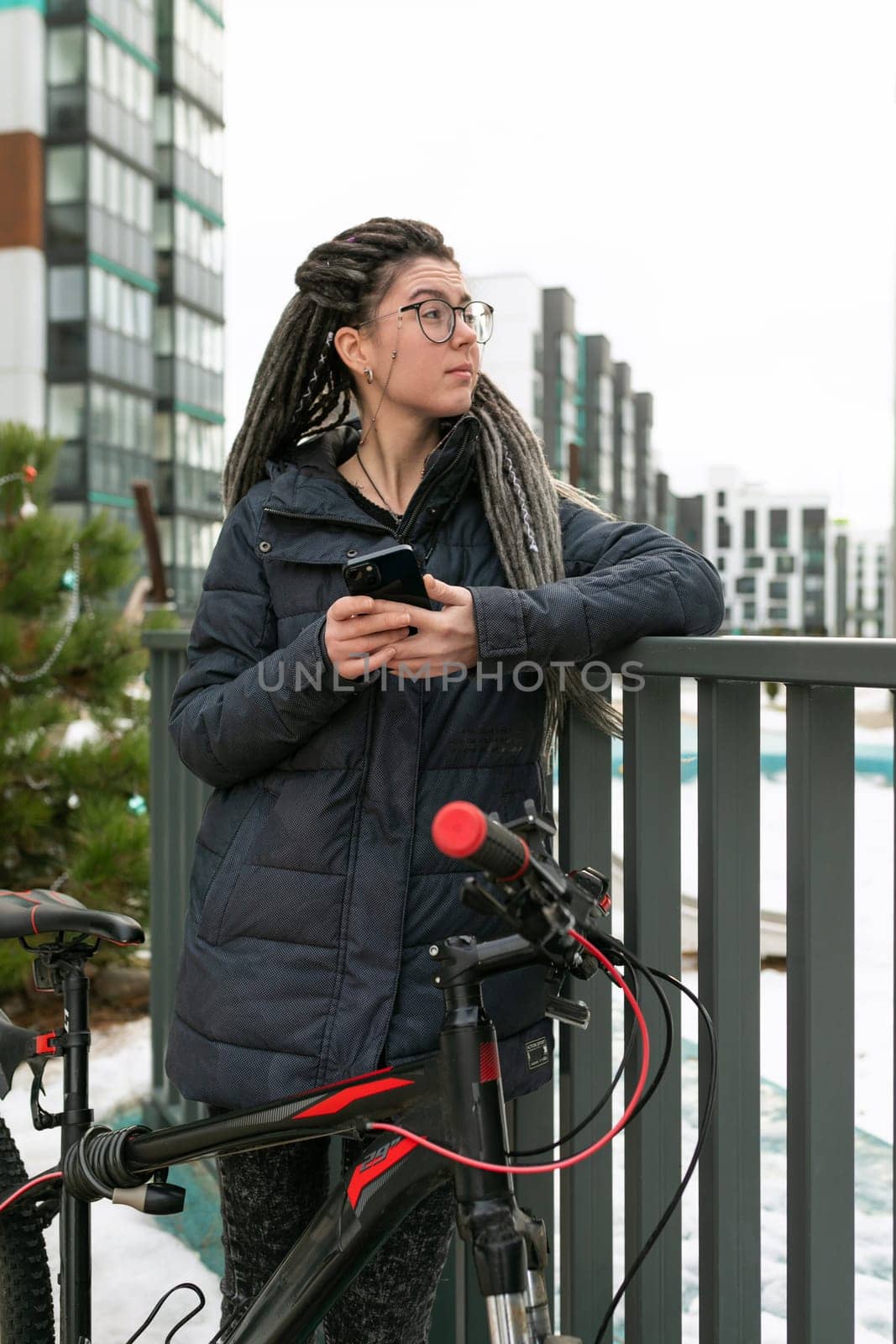 Urban pretty woman with dreadlocks hair rented a sports bike for the weekend.