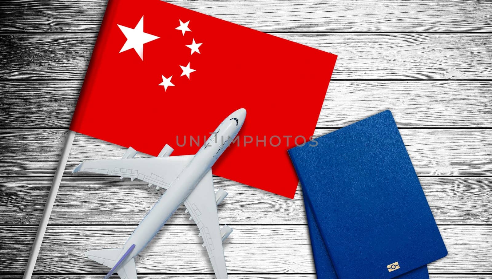 China concept. Chinese flag near passport on white background top-down copy space. High quality photo