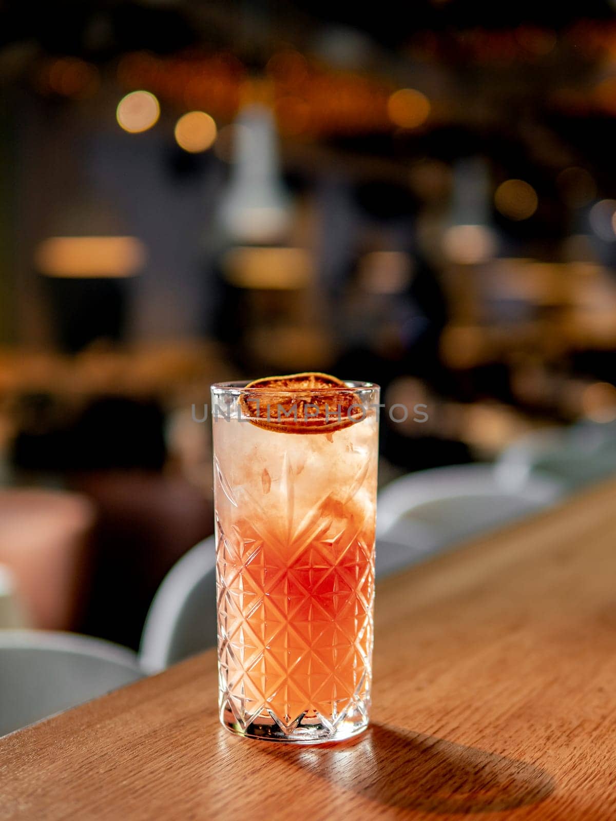Frozen citrus cocktail with triple sec in pub by fascinadora