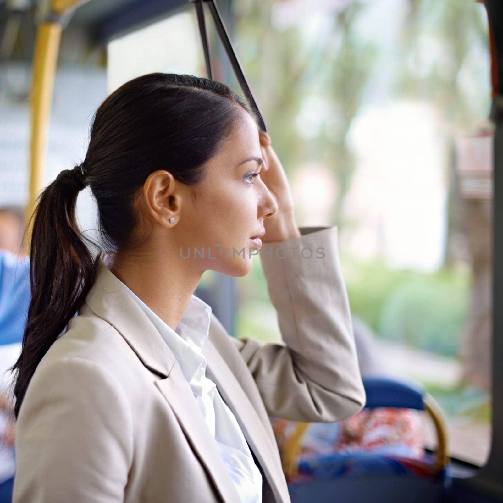 Woman, thinking and commute on public transportation or bus, journey and travel to work in city. Female person, profile and trip or transit on metro, traffic and passenger or standing in vehicle.