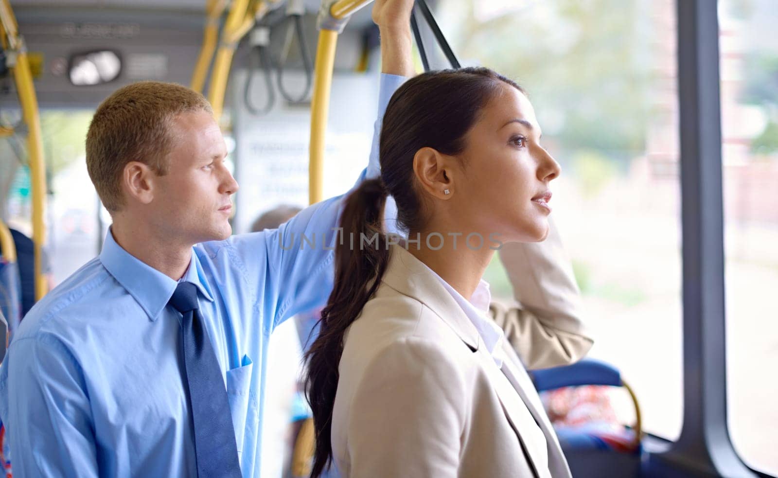 Business people, standing and commute on public transportation or bus, journey and travel to work in city. Commuters, drive and trip or transit on metro, traffic and passenger or ride in vehicle.