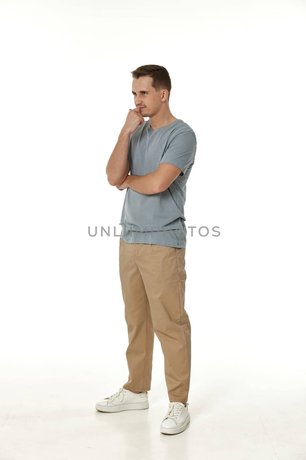 frustrated young man on white background. sadness by erstudio