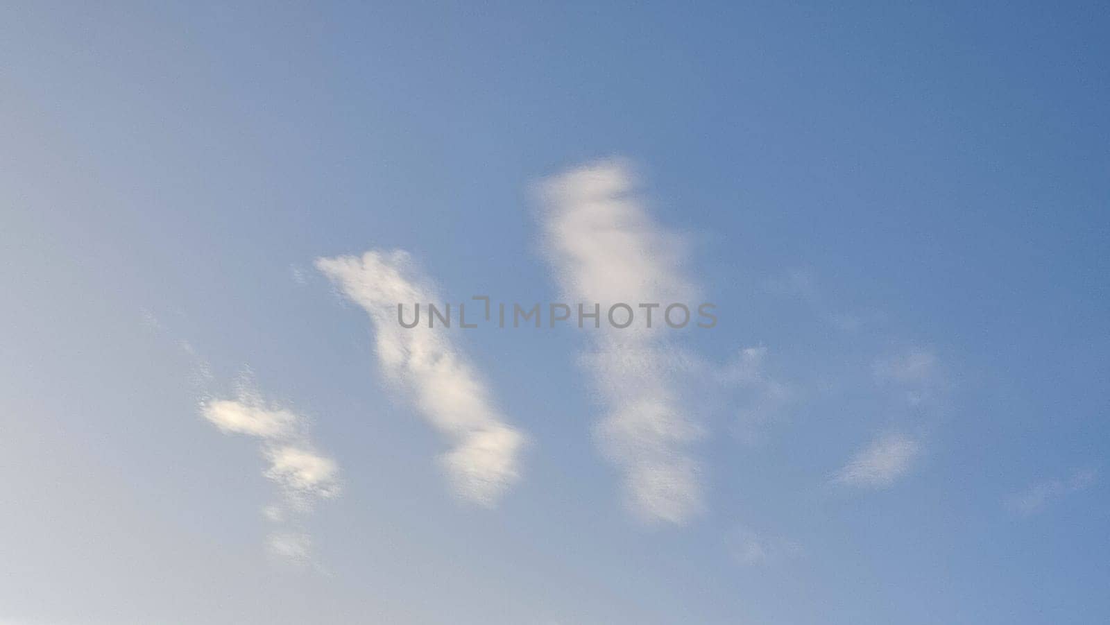 Blue light sky nature white clouds whether background . High quality photo