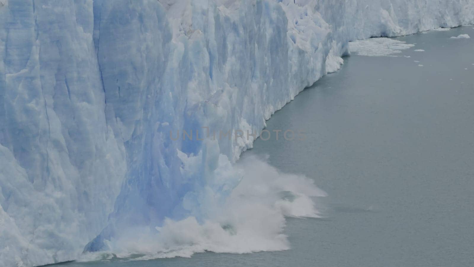 Captivating slow-mo video shows Perito Moreno Glacier's ice calving into a lake.