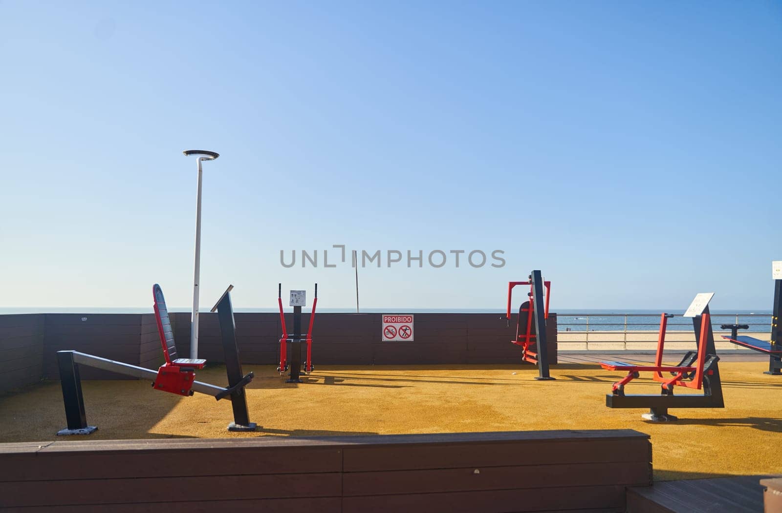 Outdoor gym with a No Dogs sign under the city skyline by driver-s