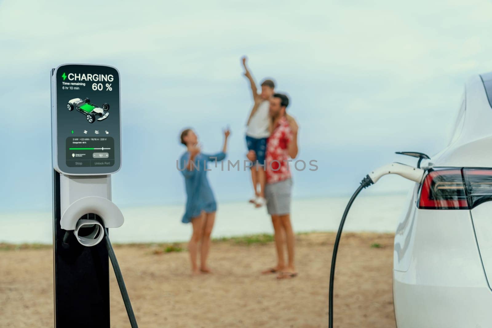 Alternative family vacation trip traveling by the beach with electric car recharging battery from EV charging station with blurred cheerful and happy family enjoying the seascape background. Perpetual