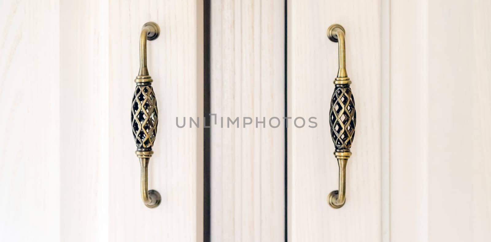 White cabinet with vintage door handles. by africapink