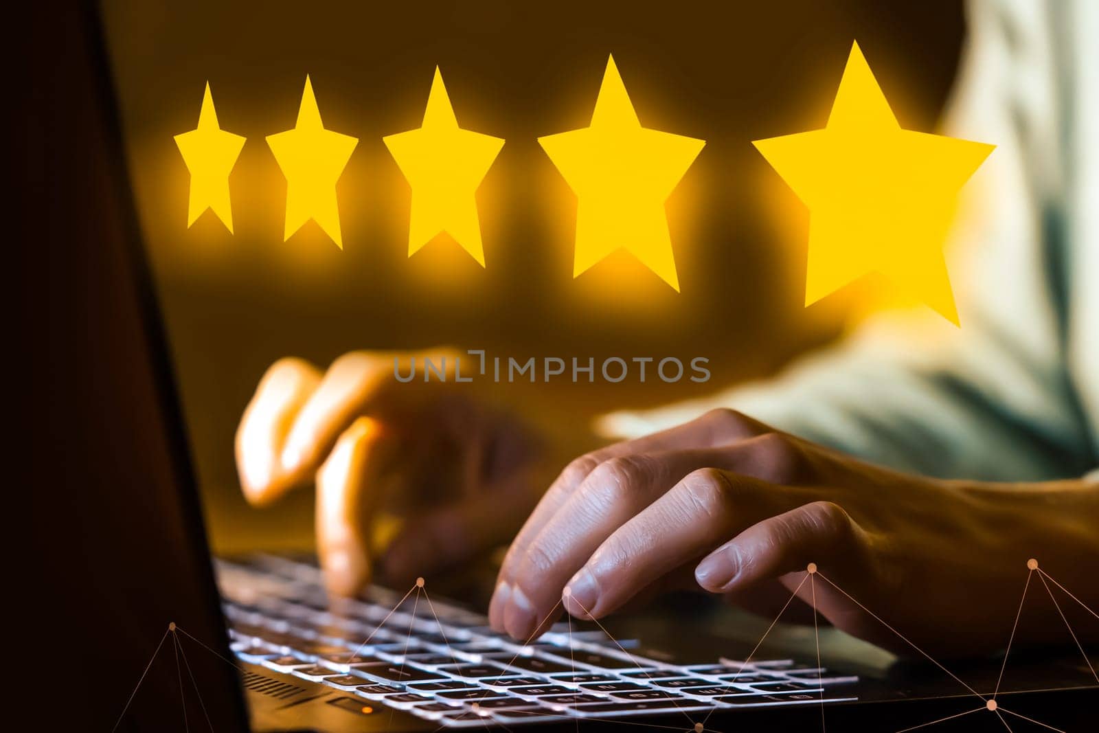 Female hands are typing on the laptop keyboard, close-up view. The person leaves a five-star review for the service, hotel, restaurant, the impression of buying online.