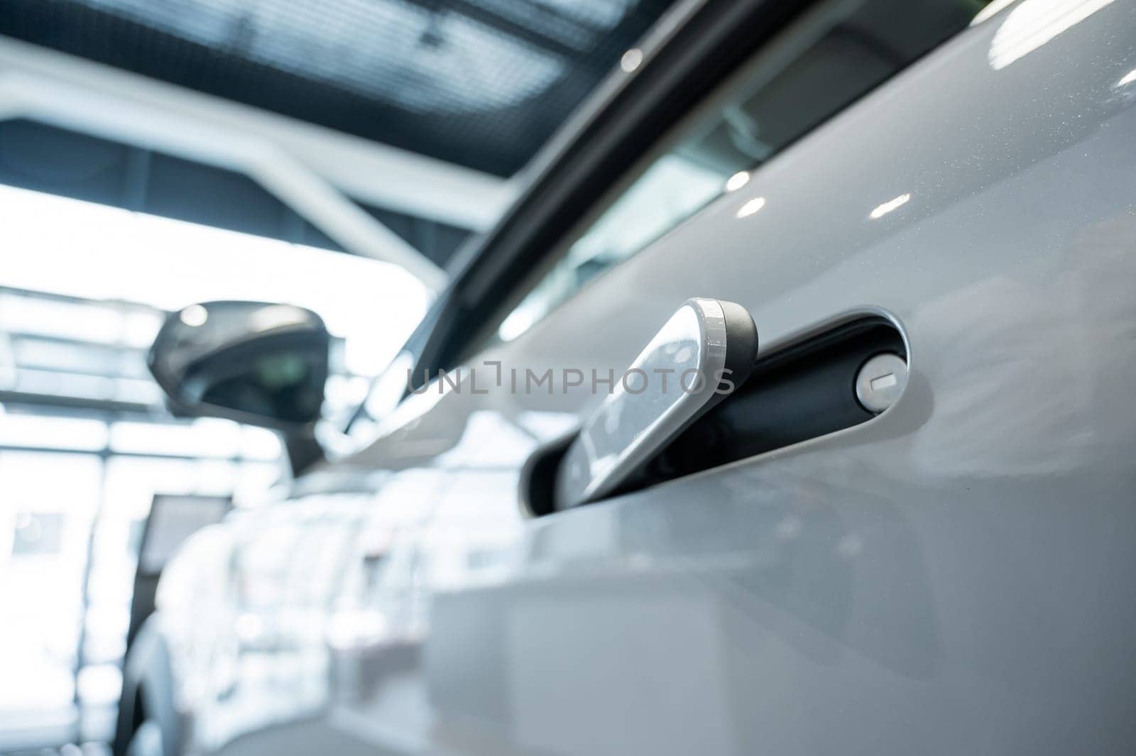 Close-up of an integrated handle in a car door. Fingerprint lock