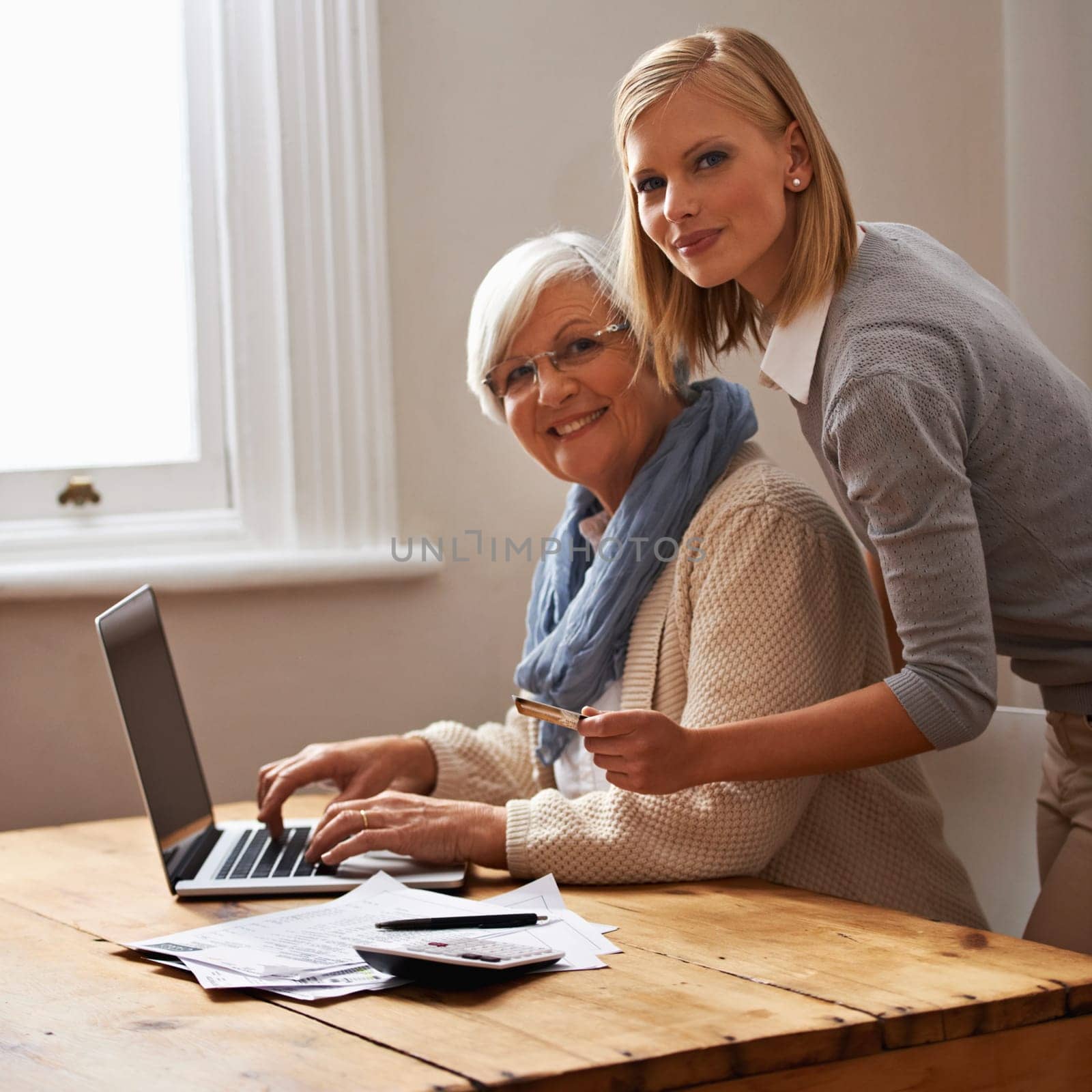 Granddaughter, grandmother and help with laptop for budget, finance and technology with advice and assistance. Women pay bills online, life insurance or tax paperwork with retirement and portrait.