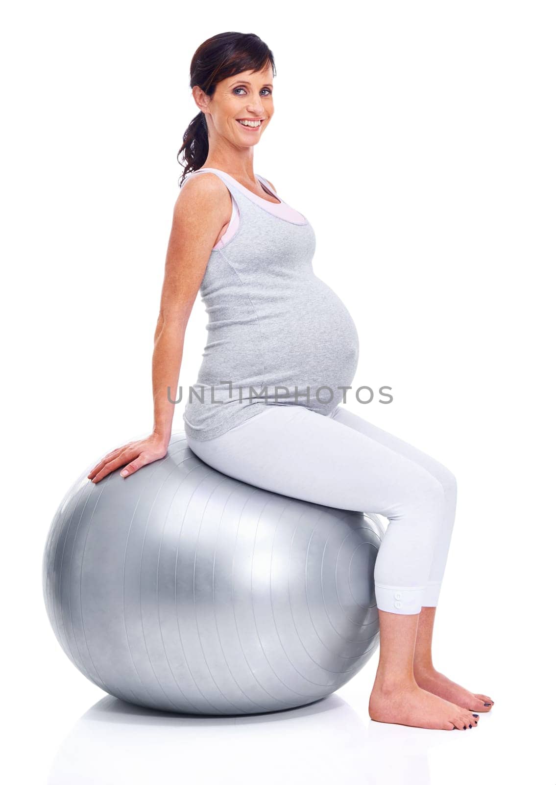 Maternal woman, ball and studio for portrait trimester, wellness and exercise for motherhood. Pregnant female person, workout and white background for health, fitness and pregnancy to keep in shape.