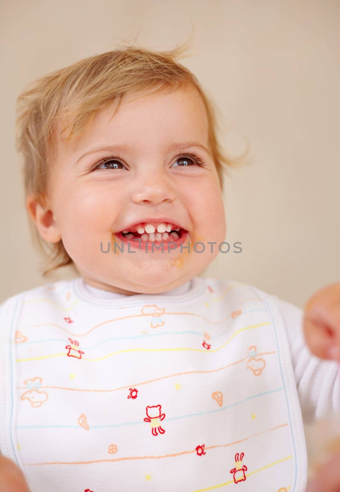 Baby girl, happiness and smile for breakfast, food and feeding with development at home, house and living room. Kid, infant and female child excited for eating, healthy diet and snacks for nutrition.