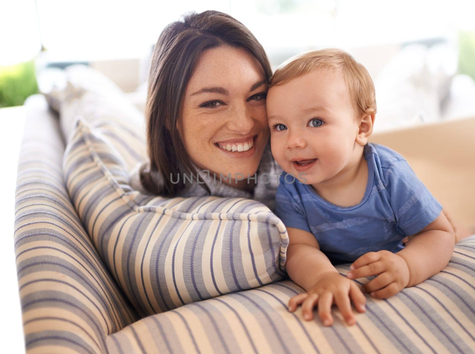 Mother, baby and portrait for love in embrace, care and support or relax in living room and comfortable. Mommy, son and affection for bonding in childhood, security and hug on couch or smile on face.